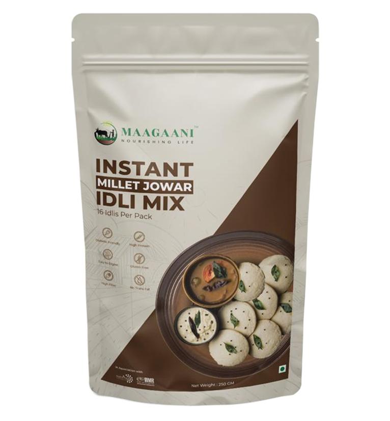 Packaging of Maagaani Instant Jowar Idli Mix featuring the product name, an image of idlis, and the claim of making 16 idlis per pack.