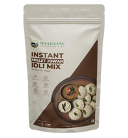Packaging of Maagaani Instant Jowar Idli Mix featuring the product name, an image of idlis, and the claim of making 16 idlis per pack.