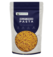 Packaging of Maagaani Low GI Jowar Millet Pasta showing the pasta inside a transparent window, with the brand logo and product information.